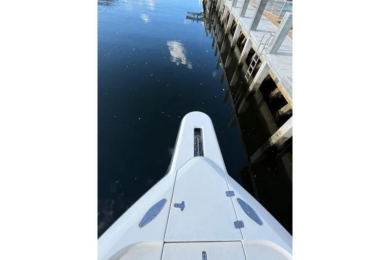 Slide: The Image of Bow view of 2001 Intrepid 377 Walkaround docked by calm water. - 31