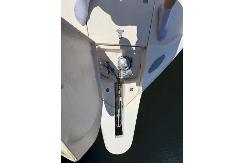 Slide: The Image of 2001 Intrepid 377 Walkaround boat anchor system with visible winch and rope. - 34