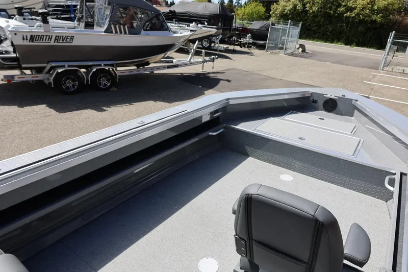 Slide: The Image of 2026 Thunder Jet 209 Rush OT boat interior with seating and storage compartments. - 20