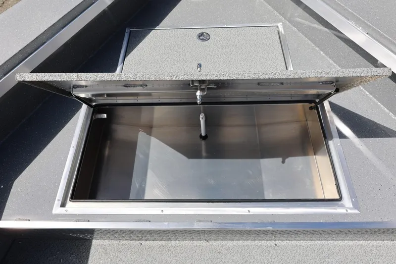 Slide: The Image of Open storage compartment on 2026 Thunder Jet 209 Rush OT boat, showcasing interior space. - 23