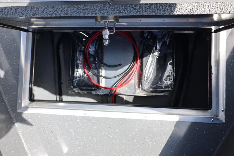Slide: The Image of Storage compartment of 2026 Thunder Jet 209 Rush OT boat with wiring and equipment. - 24