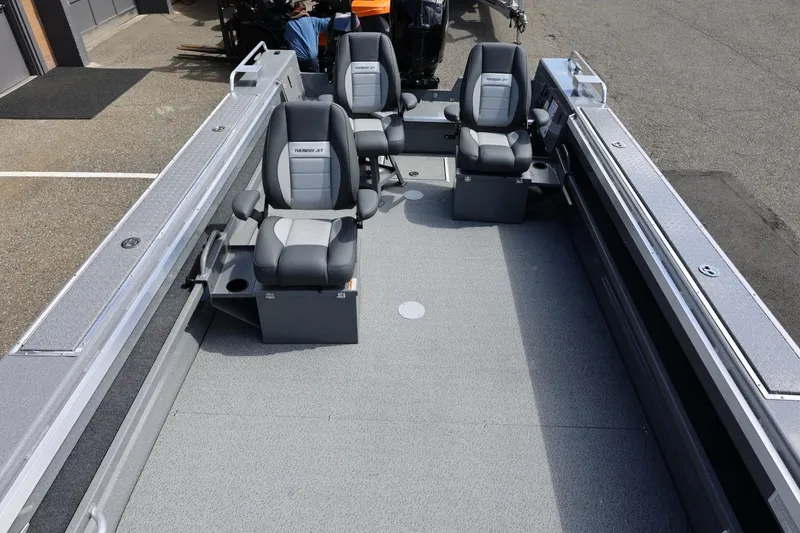 Slide: The Image of 2026 Thunder Jet 209 Rush OT boat interior with seating and spacious deck. - 25