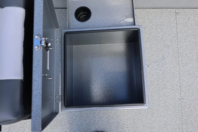 Slide: The Image of Open storage compartment in 2026 Thunder Jet 209 Rush OT boat interior. - 28