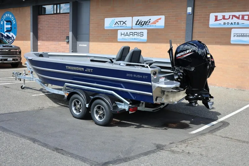 Slide: The Image of 2026 Thunder Jet 209 Rush OT boat with Mercury outboard motor on trailer. - 3
