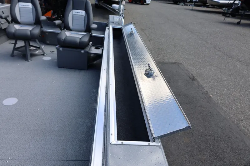 Slide: The Image of Interior view of 2026 Thunder Jet 209 Rush OT boat with open storage compartment. - 31