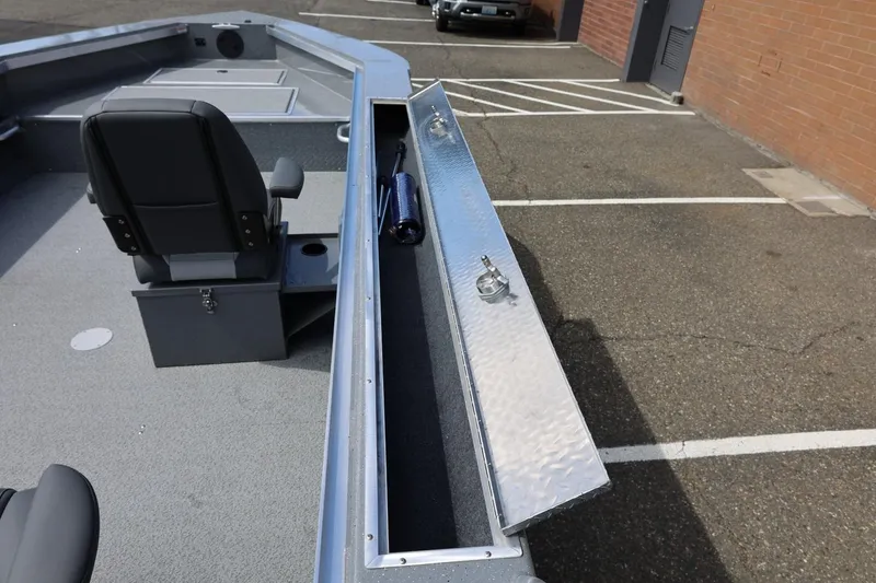 Slide: The Image of 2026 Thunder Jet 209 Rush OT boat interior with storage compartment and seating. - 33