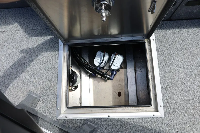 Slide: The Image of Open compartment of 2026 Thunder Jet 209 Rush OT boat showing internal components. - 35