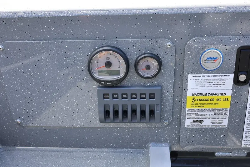 Slide: The Image of Dashboard of 2026 Thunder Jet 209 Rush OT boat with gauges and capacity label. - 37