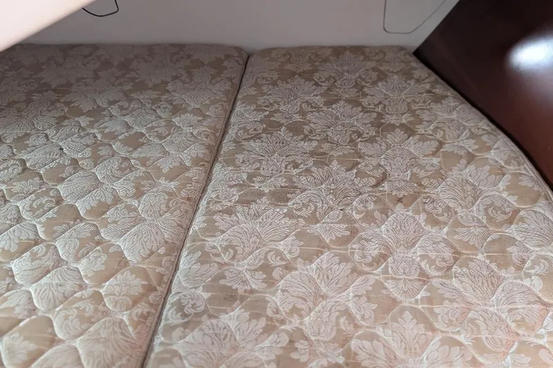 Slide: The Image of Quilted mattress in 2006 Beneteau 343 cabin, featuring elegant floral pattern. - 14