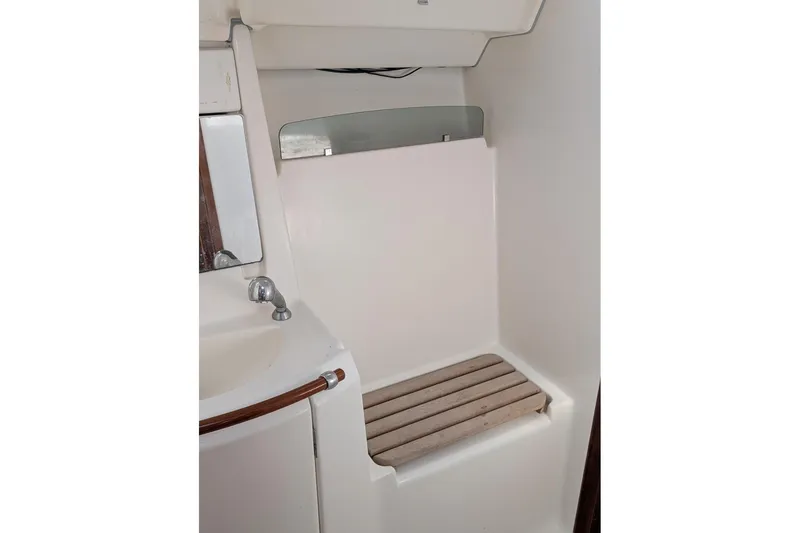 Slide: The Image of Interior of 2006 Beneteau 343 sailboat bathroom with sink and shower area. - 15