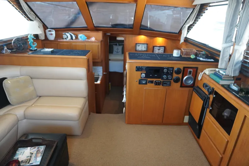 Slide: The Image of Interior of a 1996 Symbol 41 Aft Cabin Yacht with helm and seating area. - 18