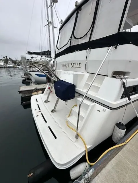 Slide: The Image of 1996 Symbol 41 Aft Cabin Motor Yacht docked at marina. - 2