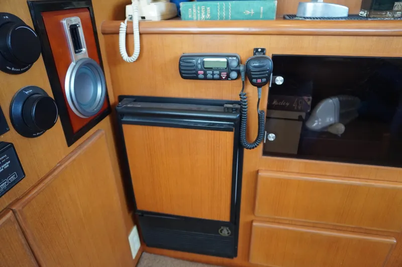 Slide: The Image of Interior of Symbol 41 yacht with radio and wooden cabinets. - 25