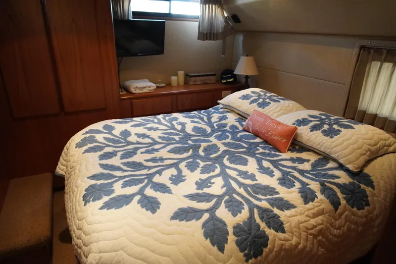 Slide: The Image of Bedroom in 1996 Symbol 41 Aft Cabin Motor Yacht with decorative bedding. - 31