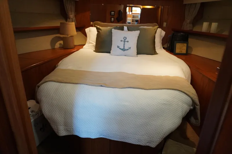 Slide: The Image of Interior of Symbol 41 Aft Cabin Yacht, cozy bedroom with anchor pillow. - 35