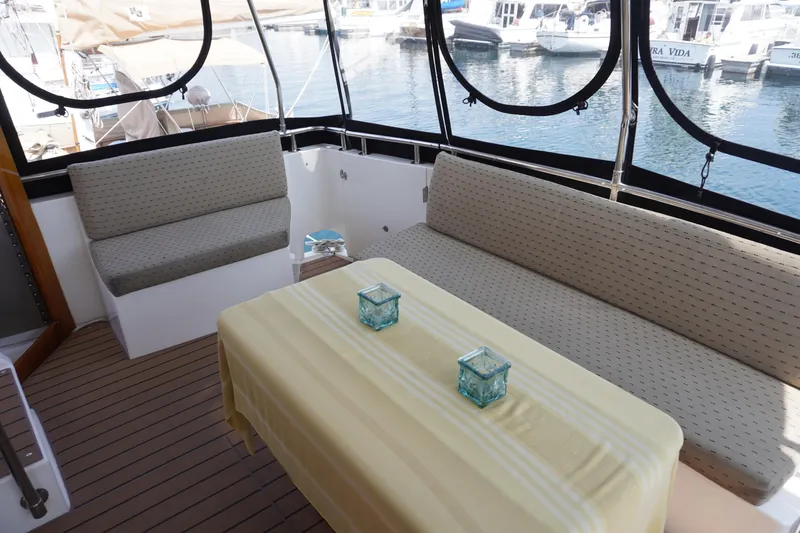 Slide: The Image of Symbol 41 Aft Cabin Yacht, cozy seating area with table, 1996 model. - 40