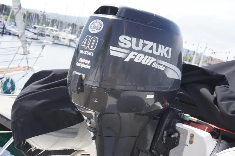 Slide: The Image of Suzuki 40 HP outboard motor on Symbol 41 yacht, year 1996. - 7