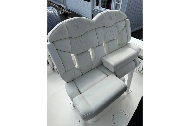 Slide: The Image of Luxurious seating on 2022 Edgewater 230CC boat, featuring plush, diamond-stitched upholstery. - 19