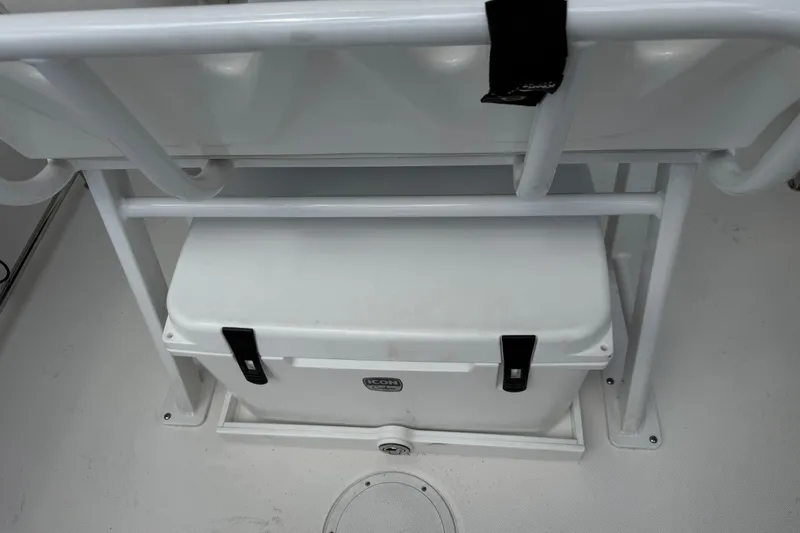 Slide: The Image of White cooler secured under seat on 2022 Edgewater 230CC boat. - 20