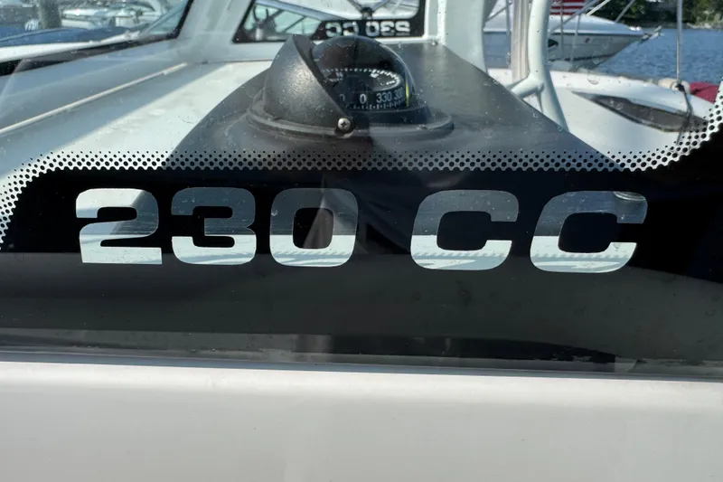 Slide: The Image of Edgewater 230CC 2022 model boat with compass, close-up view. - 24