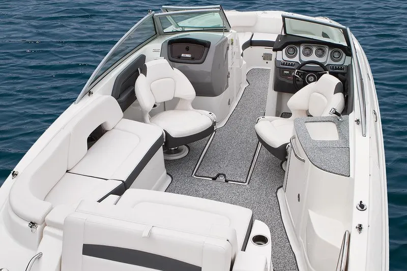 Slide: The Image of Manufacturer Provided Image: 2016 Chaparral 244 Sunesta boat interior with seating and dashboard on water. - 19