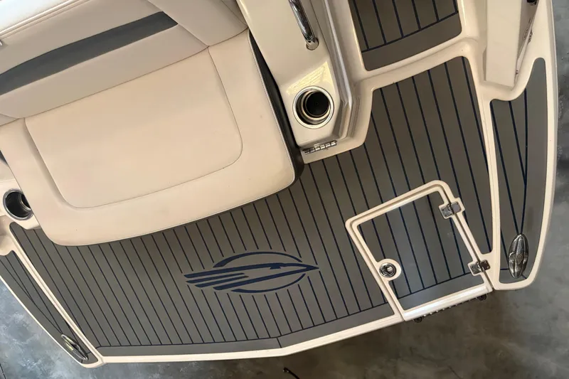 Slide: The Image of 2016 Chaparral 244 Sunesta boat deck with logo and seating area. - 8