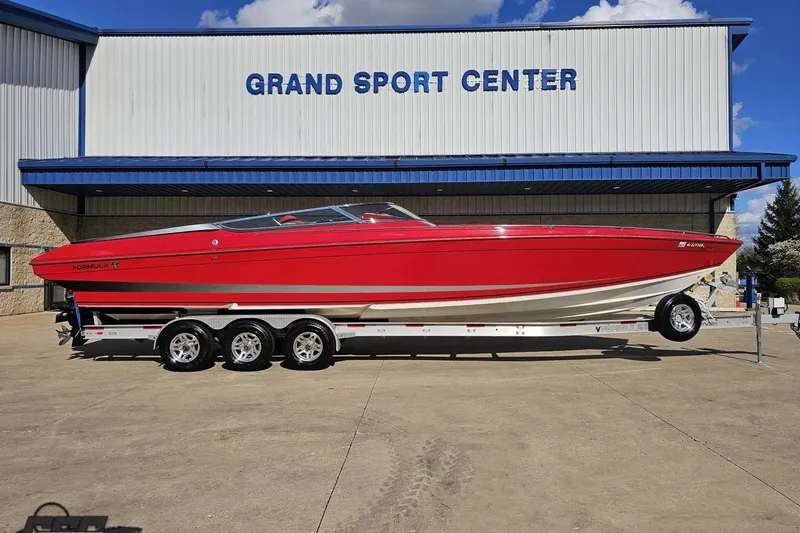 The Image of Red 1997 Formula 382 FASTech boat on trailer at Grand Sport Center. - 1