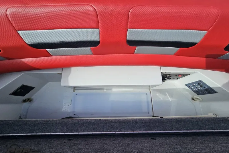 Slide: The Image of Interior view of a 1997 Formula 382 FASTech boat with red and gray upholstery. - 102