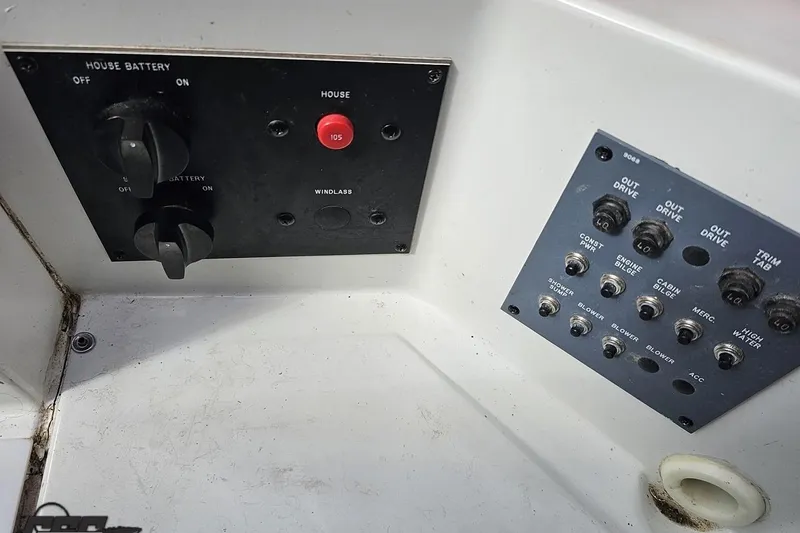 Slide: The Image of Control panel of a 1997 Formula 382 FASTech boat with switches and dials. - 103