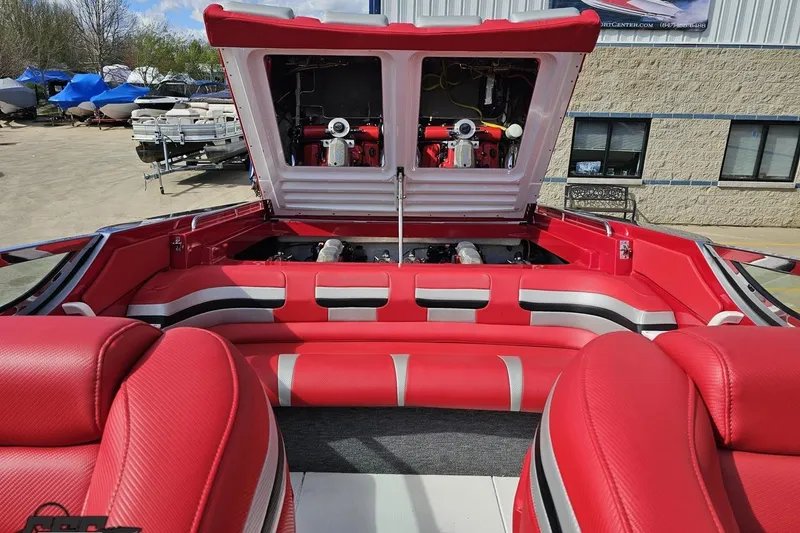 Slide: The Image of Red interior of a 1997 Formula 382 FASTech boat with open engine compartment. - 104
