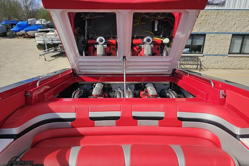 Slide: The Image of 1997 Formula 382 FASTech boat engine compartment with vibrant red upholstery. - 105