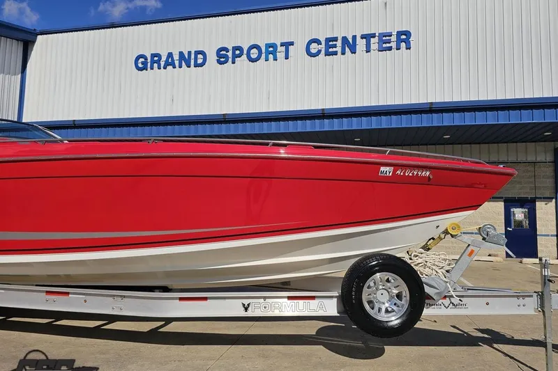 Slide: The Image of Red 1997 Formula 382 FASTech boat on trailer at Grand Sport Center. - 13