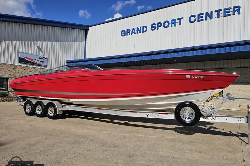 Slide: The Image of Red 1997 Formula 382 FASTech boat on trailer at Grand Sport Center. - 14
