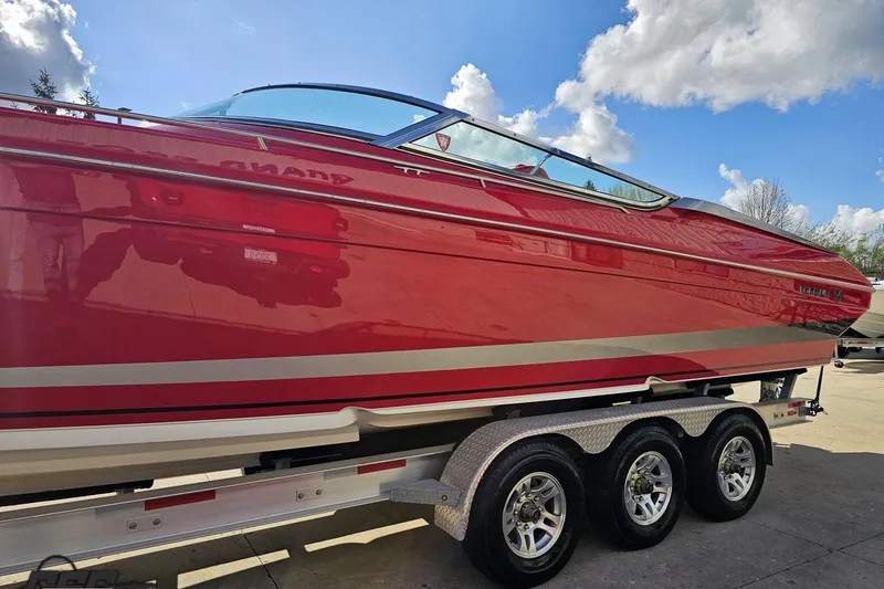Slide: The Image of Red 1997 Formula 382 FASTech boat on trailer under blue sky. - 18