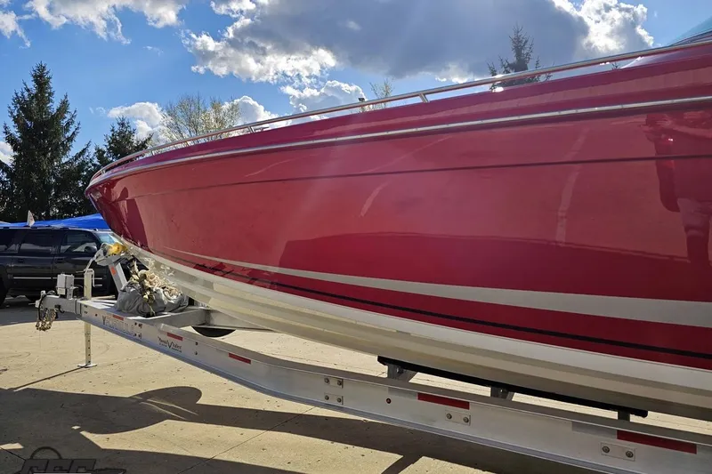 Slide: The Image of Red 1997 Formula 382 FASTech boat on trailer under a partly cloudy sky. - 19