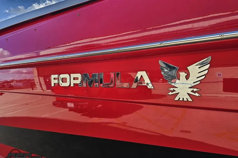 Slide: The Image of Red 1997 Formula 382 FASTech boat with chrome logo and eagle emblem. - 26