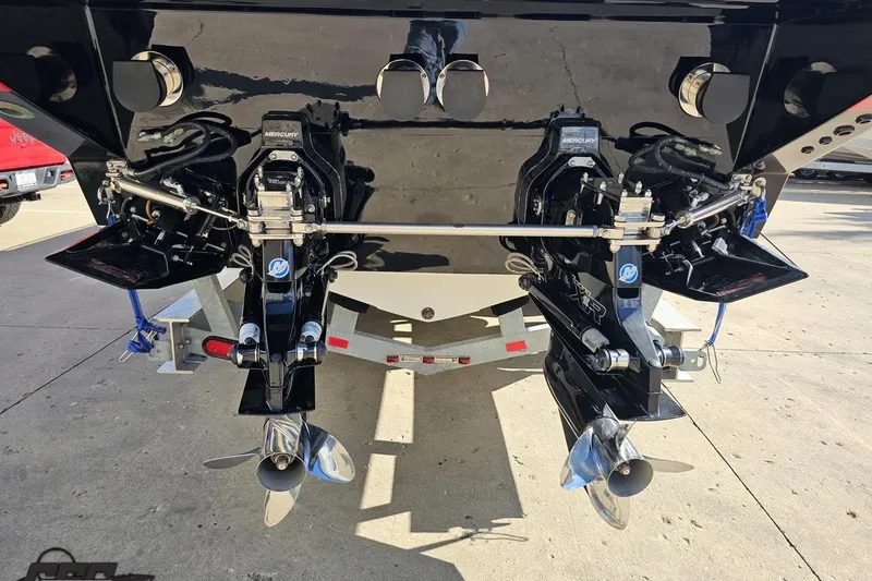 Slide: The Image of 1997 Formula 382 FASTech boat with dual Mercury outboard engines and polished propellers. - 28