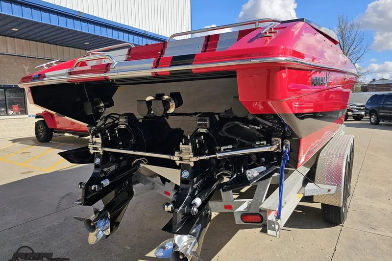 Slide: The Image of 1997 Formula 382 FASTech boat on trailer, showcasing dual outboard motors and sleek red design. - 29
