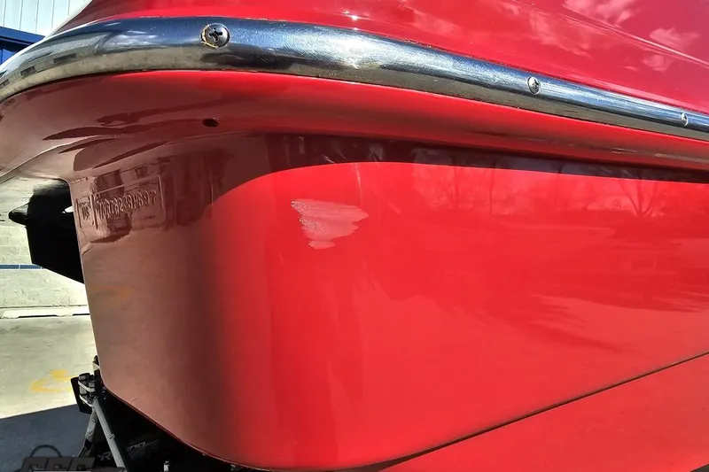 Slide: The Image of Red 1997 Formula 382 FASTech boat hull with chrome trim detail. - 31