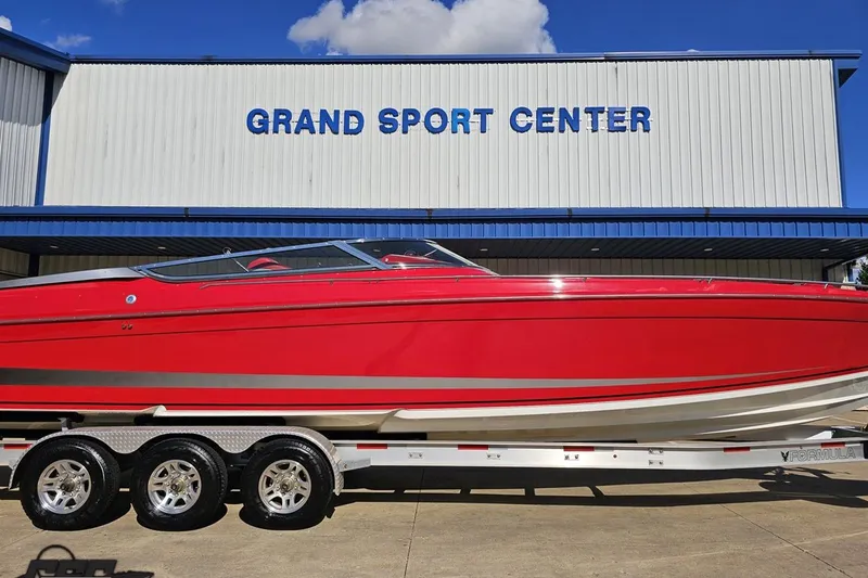 Slide: The Image of Red 1997 Formula 382 FASTech boat on trailer at Grand Sport Center. - 4