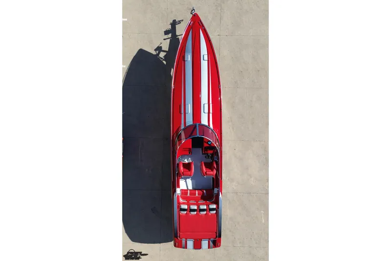Slide: The Image of Aerial view of a red 1997 Formula 382 FASTech speedboat with white stripes. - 40