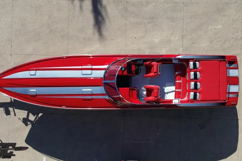 Slide: The Image of Overhead view of a 1997 Formula 382 FASTech speedboat, red with silver accents. - 41