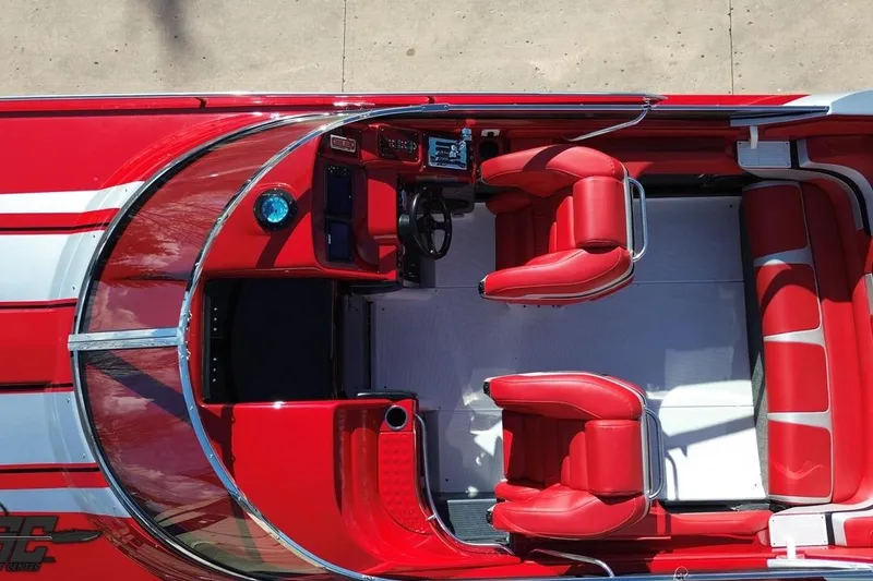 Slide: The Image of Overhead view of 1997 Formula 382 FASTech boat interior with red seating and dashboard. - 42