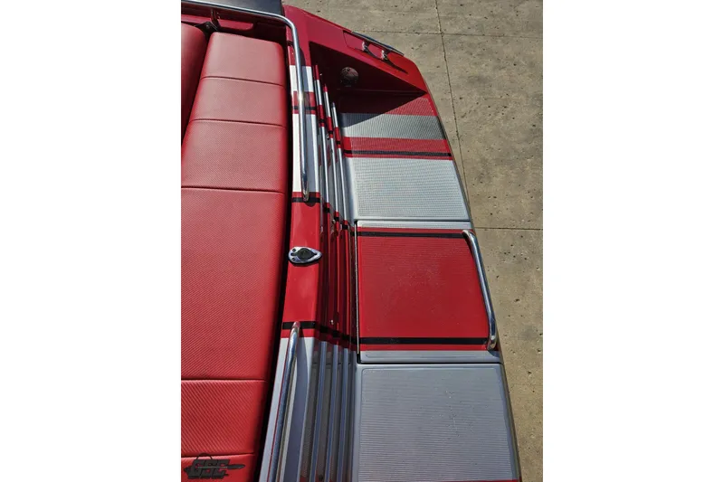 Slide: The Image of Red and silver deck of a 1997 Formula 382 FASTech boat, showcasing sleek design. - 46