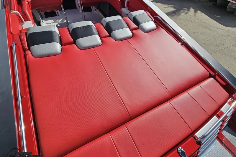 Slide: The Image of Red interior of a 1997 Formula 382 FASTech boat with cushioned seating. - 47