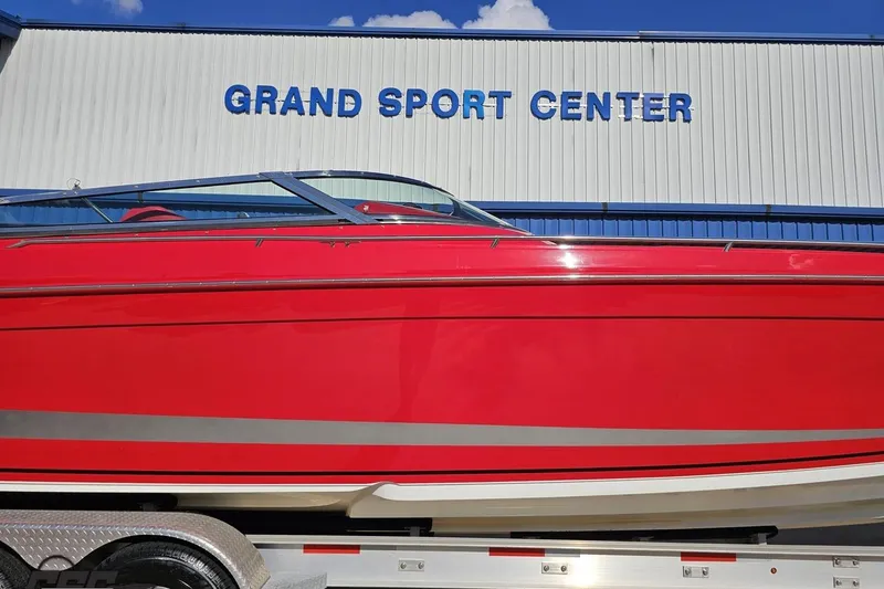 Slide: The Image of Red 1997 Formula 382 FASTech boat at Grand Sport Center, displayed on a trailer. - 5