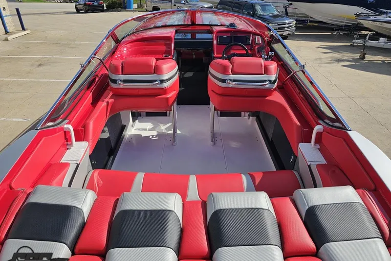 Slide: The Image of Red and gray interior of a 1997 Formula 382 FASTech boat, showcasing seating and dashboard. - 51