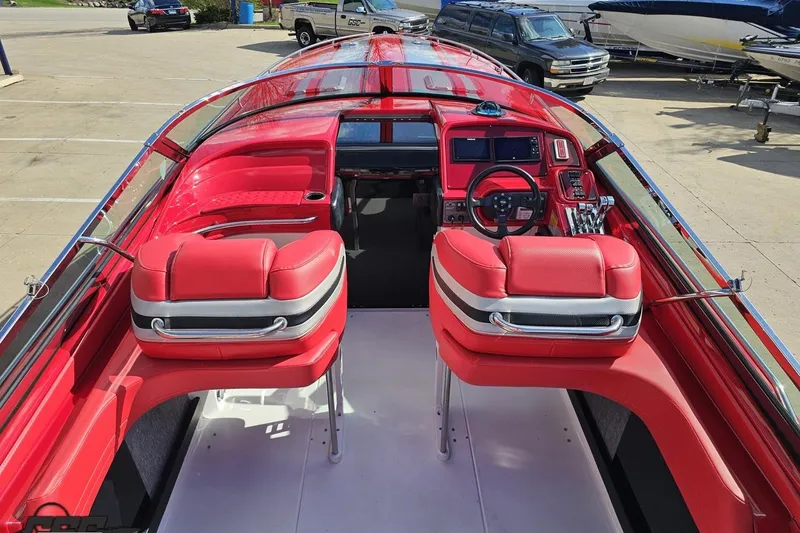 Slide: The Image of Red interior of a 1997 Formula 382 FASTech boat with dual seats and dashboard. - 52