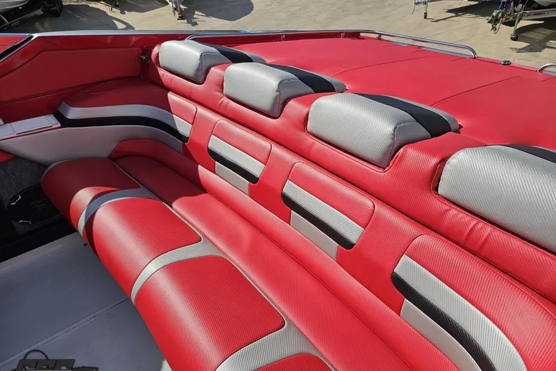 Slide: The Image of Red and gray interior seating of a 1997 Formula 382 FASTech boat. - 54