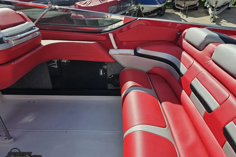 Slide: The Image of Red and gray interior of a 1997 Formula 382 FASTech boat, showcasing sleek seating design. - 55